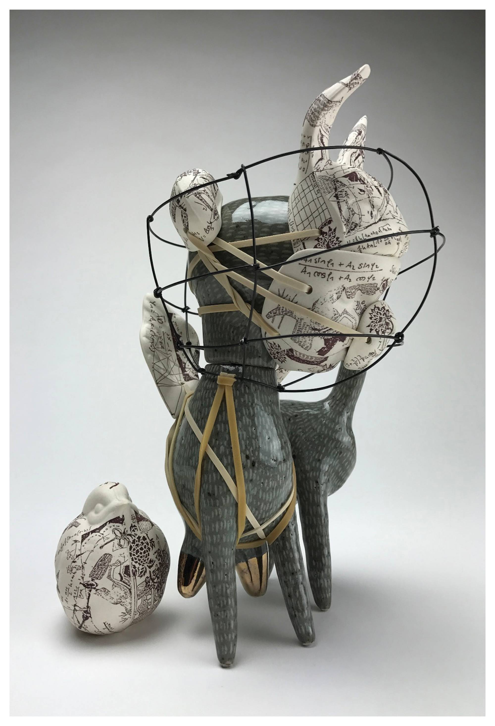 Ceramic Dog with wire cone around head